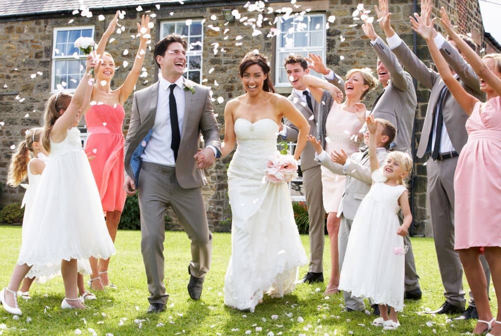 wedding guests throwing confetti