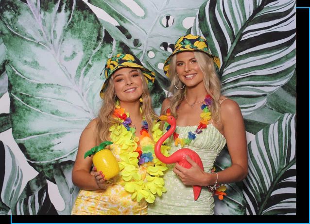 Two girls in party outfits using Perth Affordable Photo Booth Hire